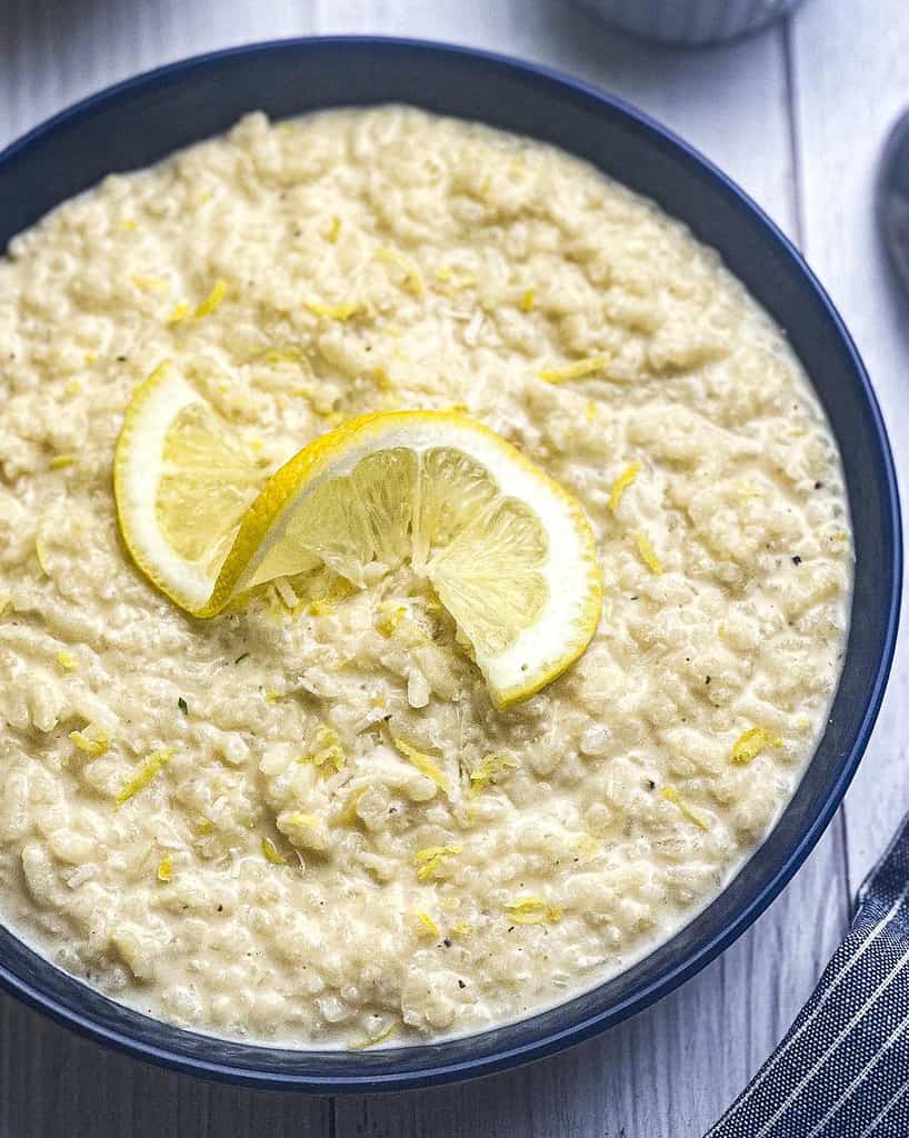 Creamy lemon risotto in a blue bowl.
