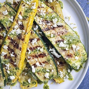 Grilled zucchini and squash with lemon basil drizzle and feta cheese.
