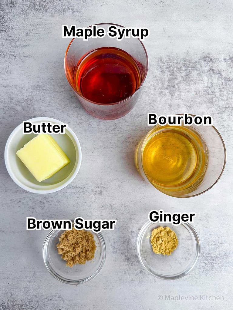 Ingredients for maple bourbon glaze in small bowls.