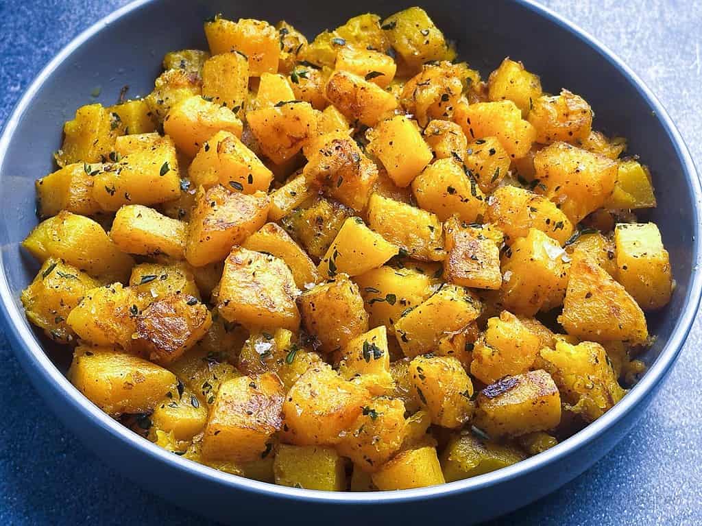 Sauteed butternut squash with herbs in a bowl