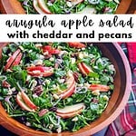 Arugula, apples, cheddar, pecans in a wooden salad bowl with the title of the recipe for pinterest.