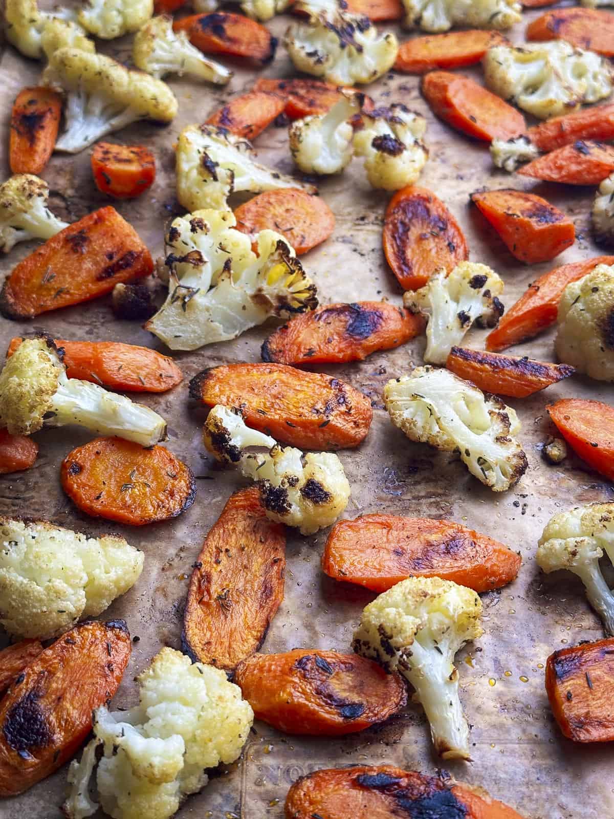 Close up shot of roasted carrots and cauliflower.