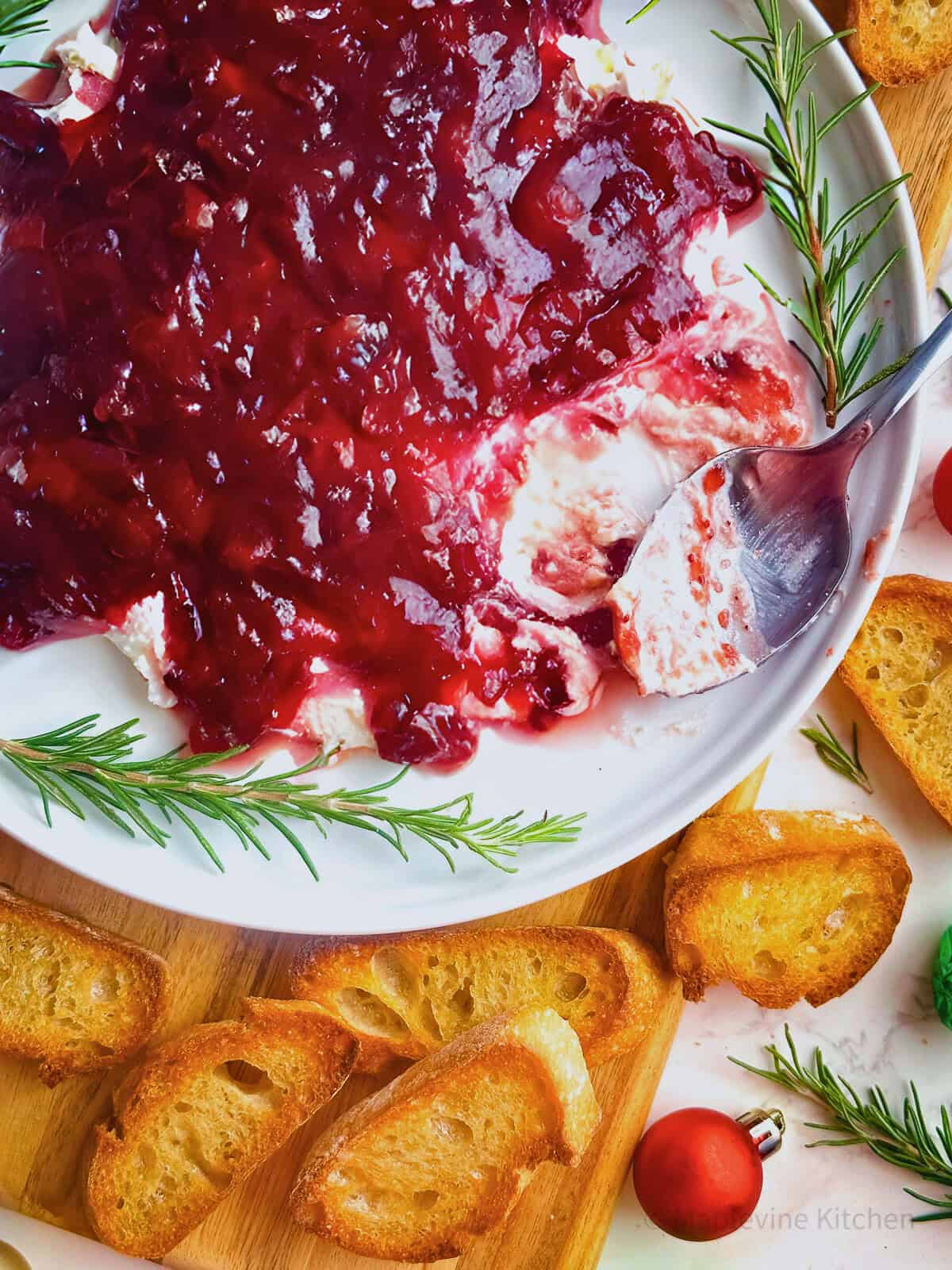 Cranberry whipped feta dip with rosemary and crostini.