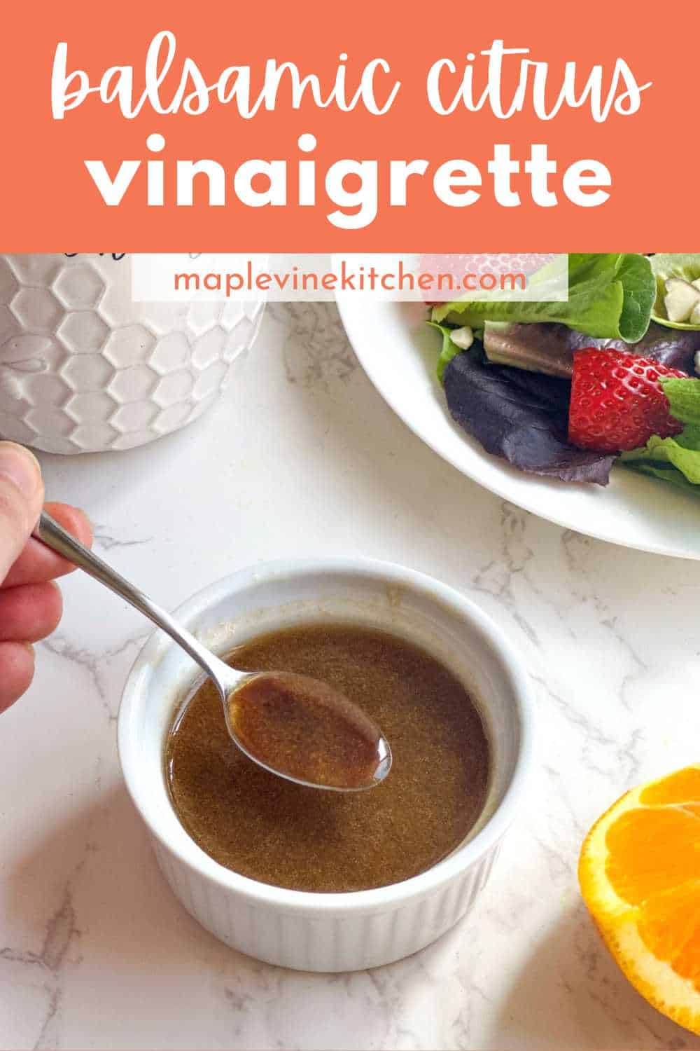 Balsamic citrus vinaigrette in a white ramekin with a spoon dipping in.