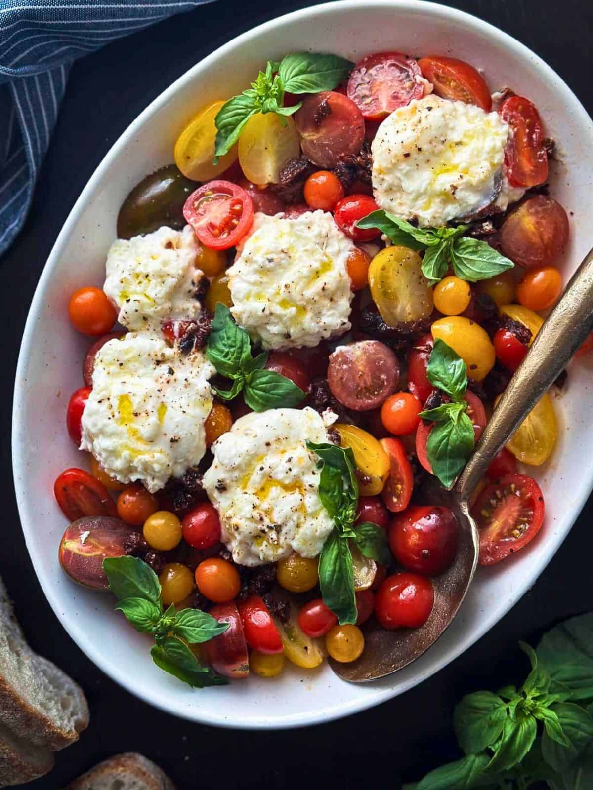 Burrata caprese salad and a white platter.