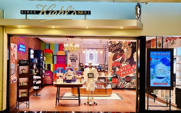 Kiehl's store entrance with colorful displays and vintage decor.