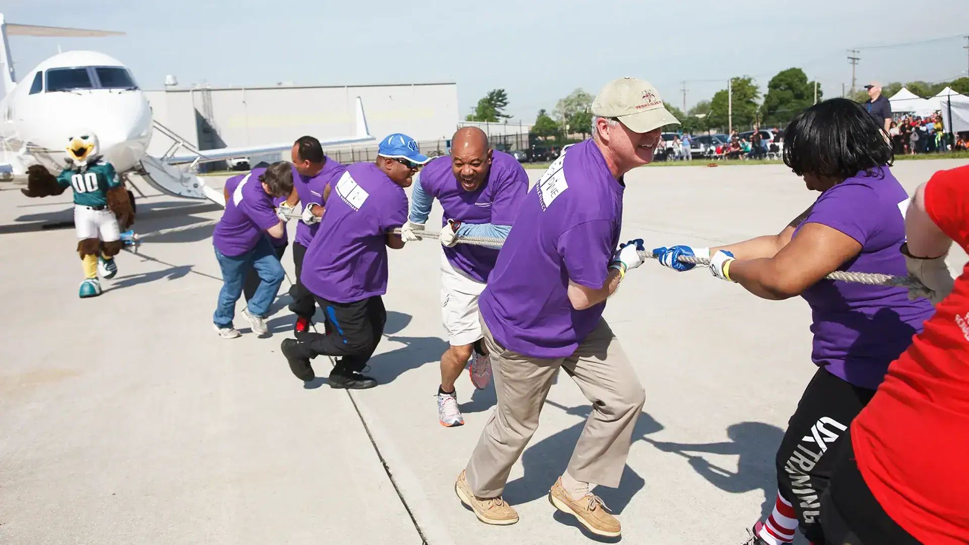 Team Building Day where employees are seen participating in rope knots game