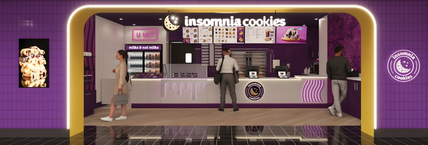 Insomnia Cookies shop interior with customers ordering and staff behind the counter.
