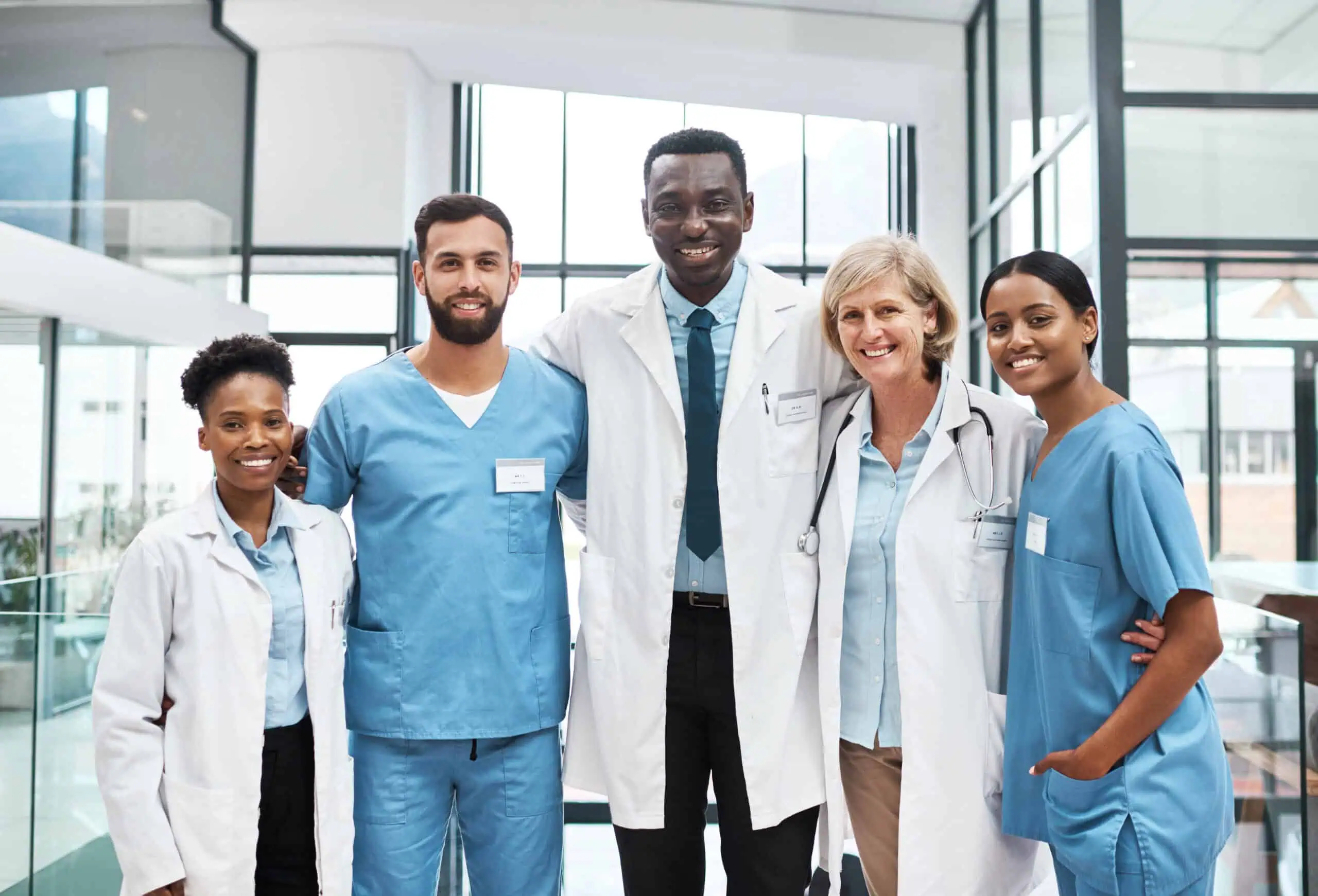 Group of medical professionals standing together in a modern healthcare setting