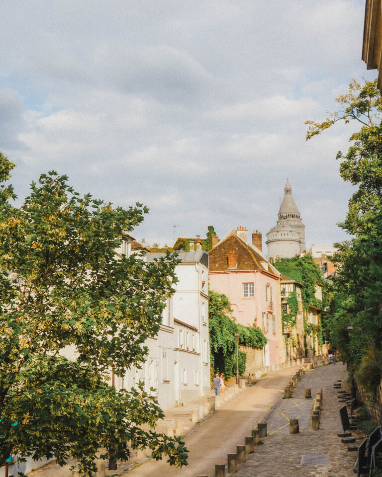 Walk the cobblestone streets of Rue de l'Abreuvoir and admire the beautiful Parisian architecture. I love the area near Le Moulin de la Galette, it feels like you've stepped back in time to Paris circa the 1920s. It is such a beautiful area of Paris to make time for. If you go at sunset and walk to the end of the street, the street does slope upwards and the charming Parisian buildings, some with foliage cascading down as well as the neighborhood foliage and cobblestone street make for such a charming photo.
