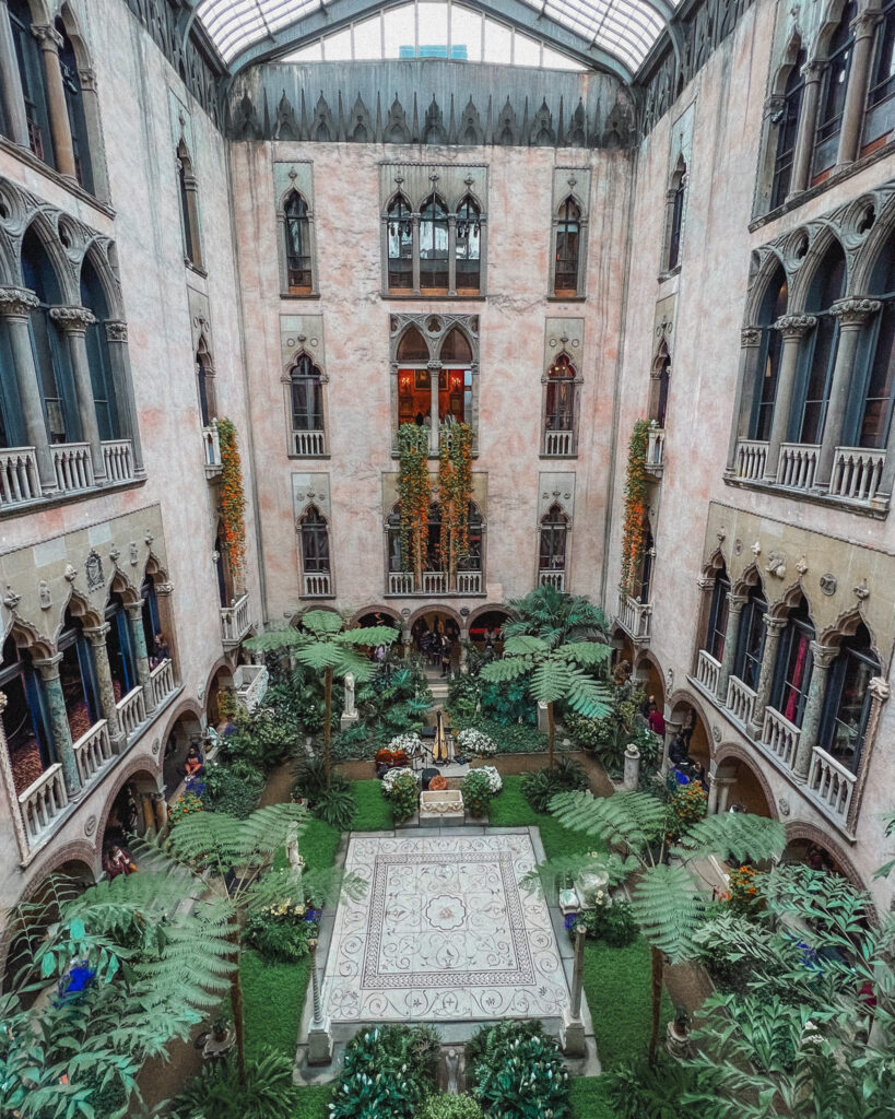 the Isabella Stewart Gardner Museum is one of the most beautiful places in Boston and should definitely be included on your 4 days in Boston itinerary. The courtyard is the most stunning place of the museum and is a covered courtyard that's surrounded on all four sides by the four story museum. You can essentially see the facades of the museum that resembles a European types of architecture. The museum changes the greenery here each season, and in the spring that have hanging nasturtiums from the third and second floors that cascade down into the gardens.