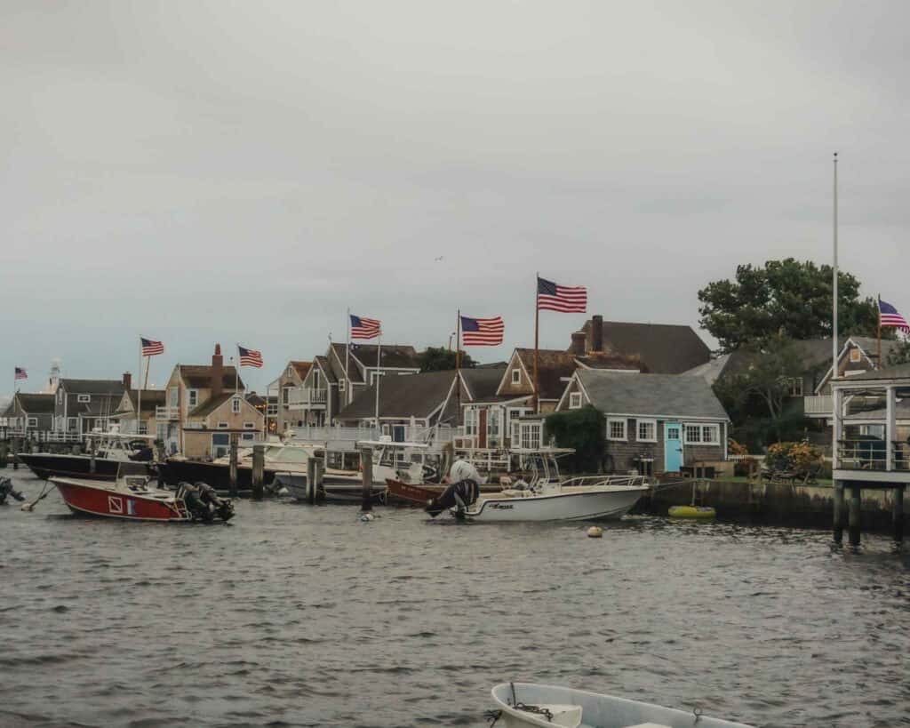 When planning a day trip to Nantucket don't forget to stop and admire these oceanfront views. This view is very close to the harbor where the ferry disembarks, and these smaller cottages right along the water all have their American flags hanging in unison making for quite the picture perfect scene.