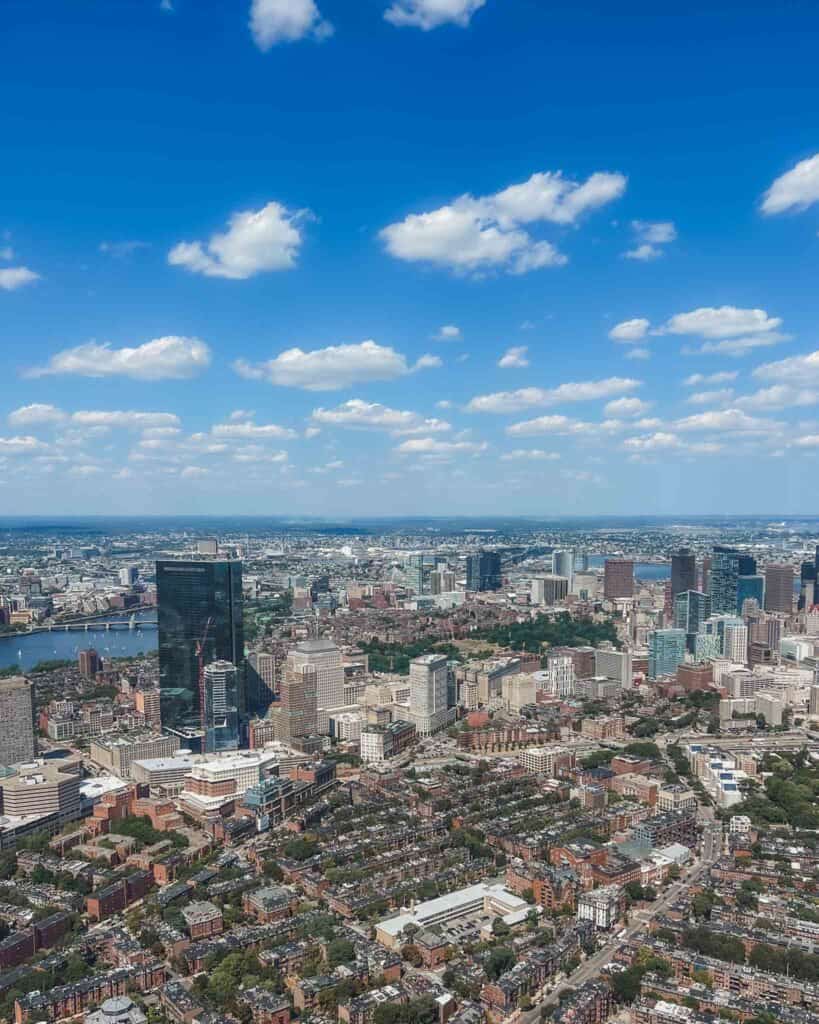 Here's an incredible view of the city and all the neighborhoods of where to stay in Boston your first time. You can find this view from the top of the Prudential Center or Prudential Tower.
