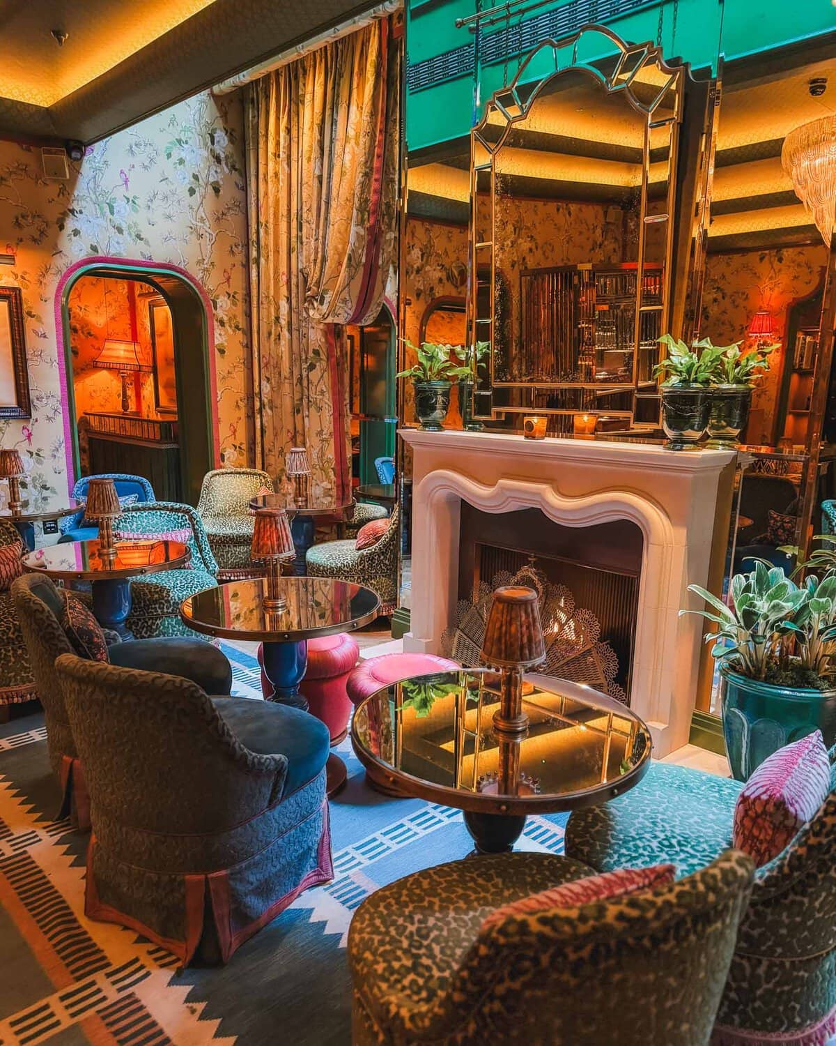 This is the Broadwick Soho hotel which places a high emphasis on design with bold and playful maximalist aesthetic. It blends 1970s glamour of a Soho townhouse. The floral wallpaper here mixed with leopard tufted chairs and art deco mirrors really make the space.