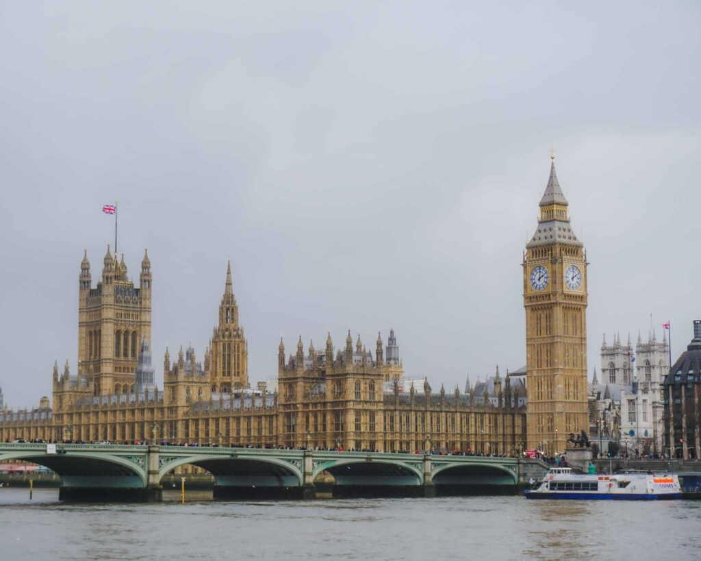 You can't plan a 4 day itinerary London without visiting Big Ben and Parliament shown here with Westminster Bridge and the River Thames in the foreground.