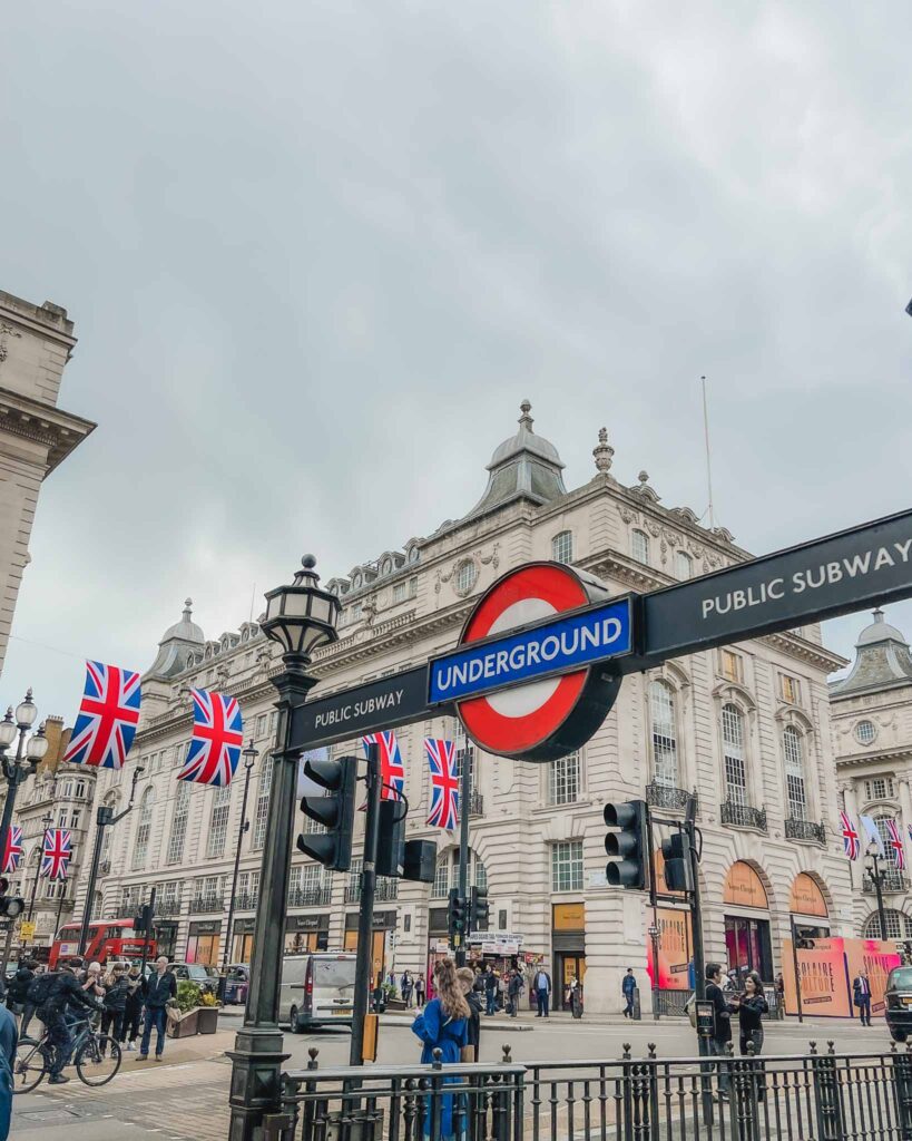 Piccadilly Circus is surrounded by classic London, grand Victorian architecture and streets that intersects where you can watch all the red, double decker buses go by!