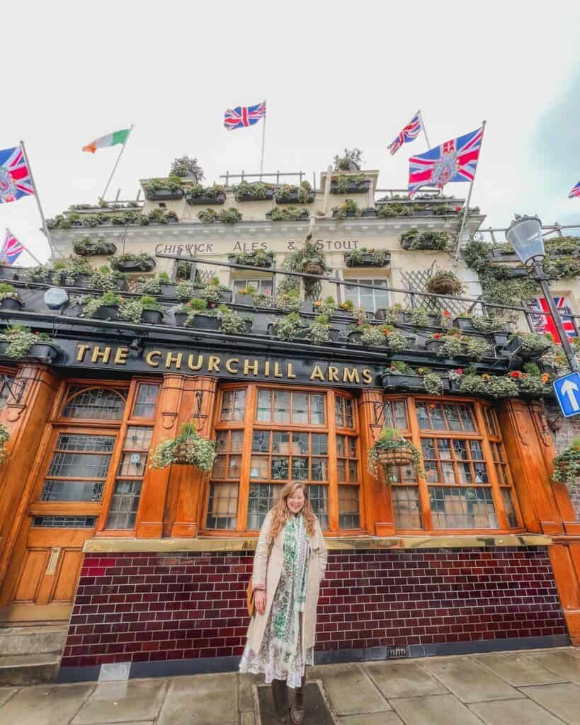 The Churchill Arms is one of the most famous English pubs in London, It's a three story establishment decorated with flowers lining the entire perimeter and a mix of English and Irish flags jutting out from its facades as well.