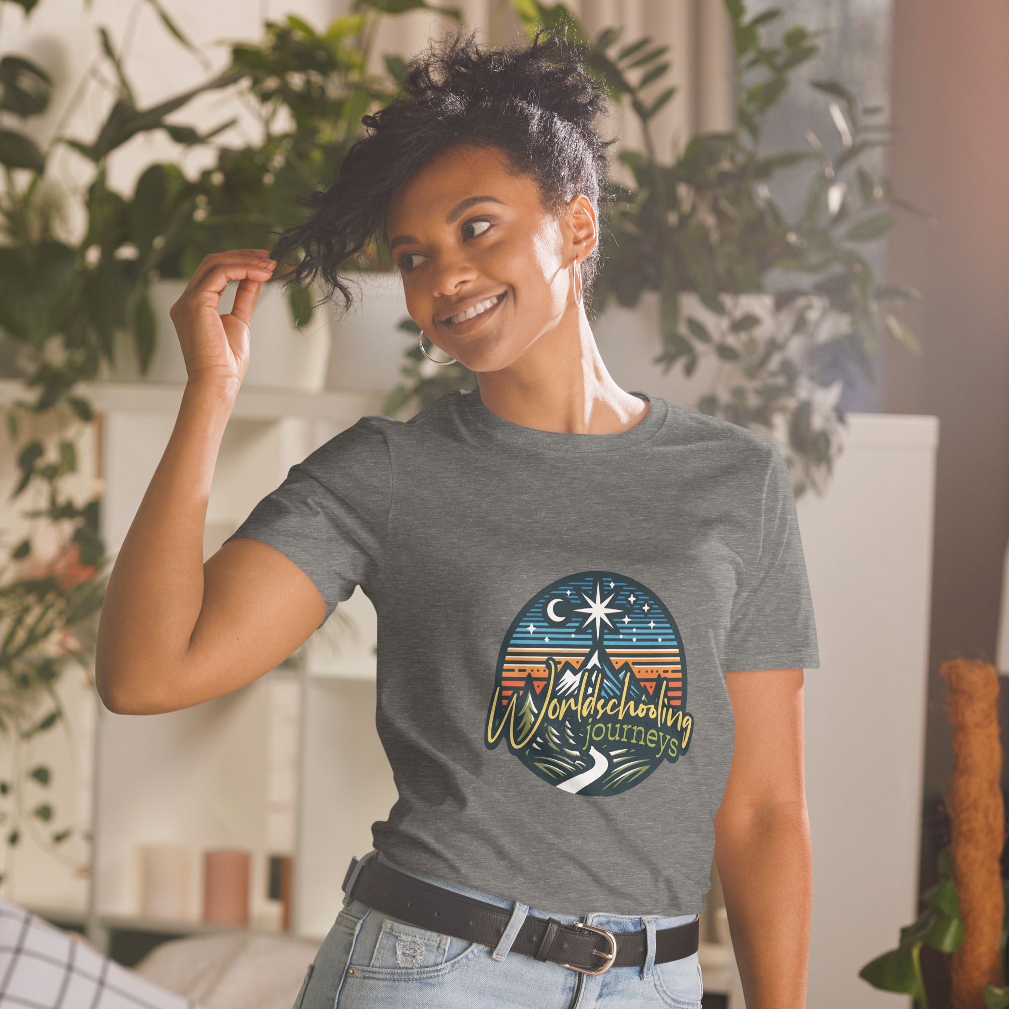 A stylish women’s T-shirt with a colorful mountain and night sky design, celebrating travel and adventures, ideal for wanderlust lovers.