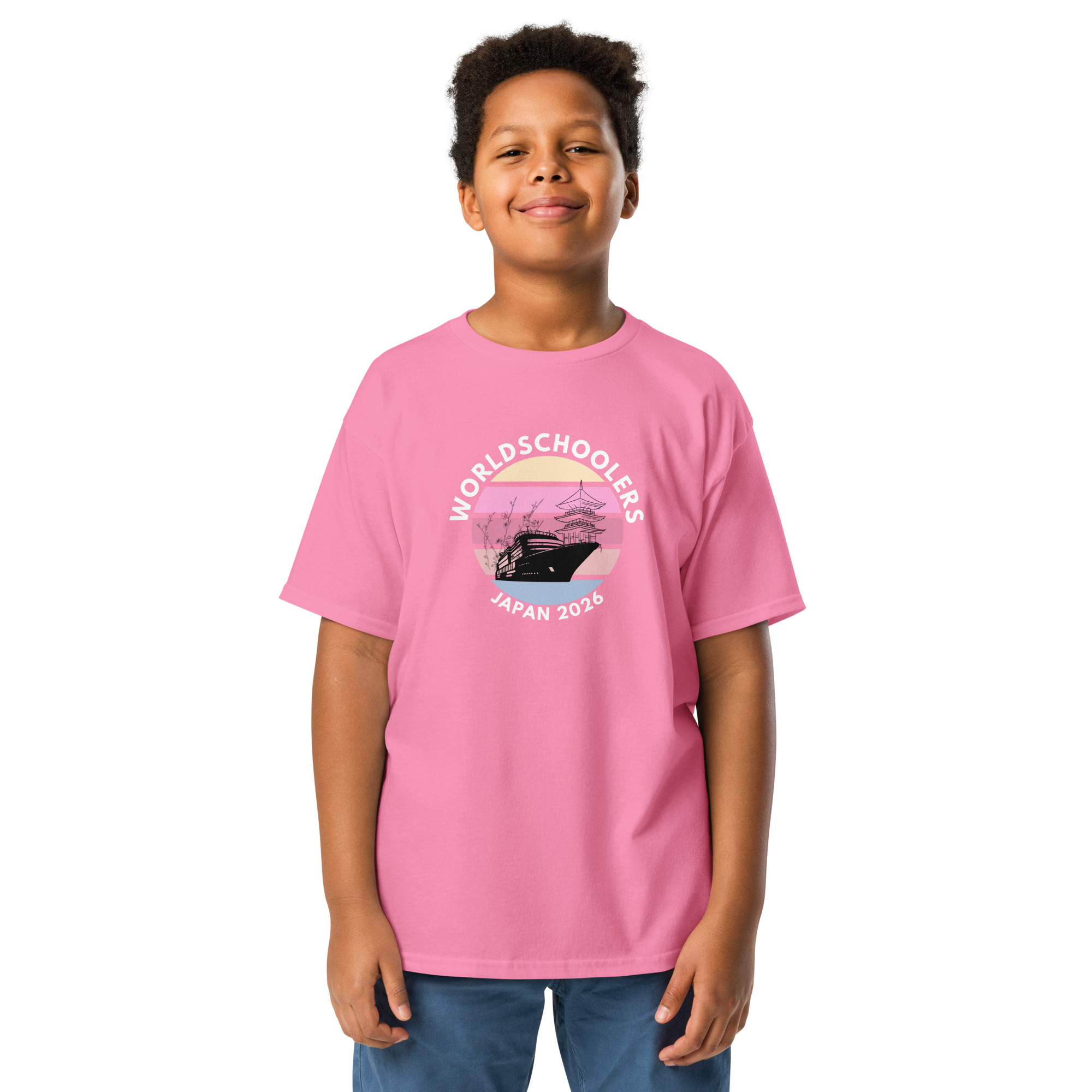 Child wearing pink Japan 2026 Youth Classic Tee with graphic design of a traditional Japanese pagoda and cherry blossoms, perfect for youth fans of Japan travel and culture.