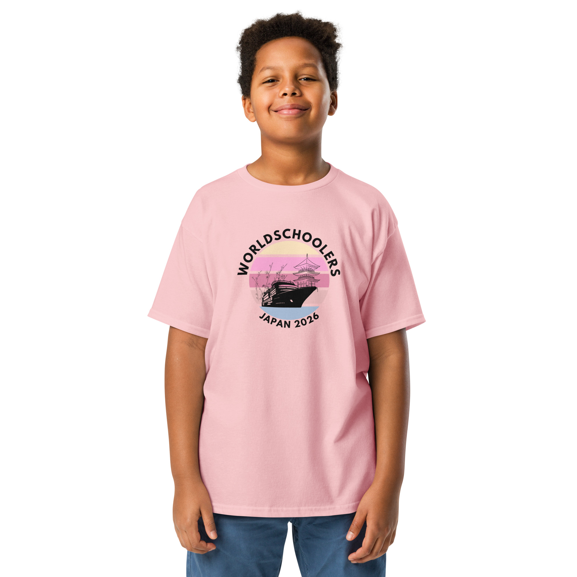 Child wearing a pink Japan 2026 Youth Classic Tee with a graphic design featuring a traditional Japanese pagoda and cherry blossoms, perfect for fans of Japan 2026 events.