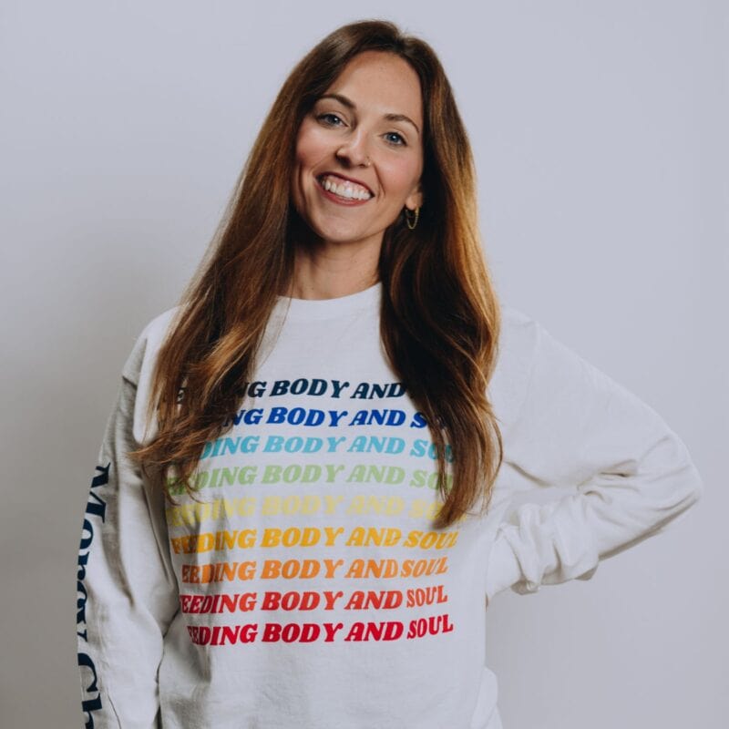 A front view of Mercy Chefs' white Feeding Body and Soul long sleeve