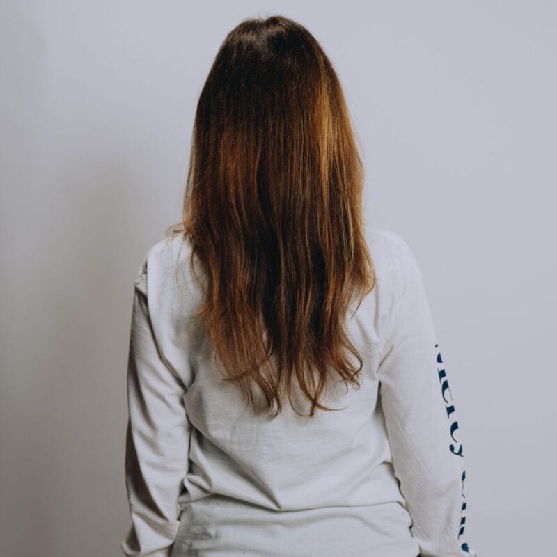 A back view of Mercy Chefs' white Feeding Body and Soul long sleeve