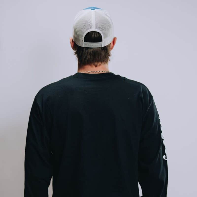 A back view of Mercy Chefs' black Feeding Body and Soul long sleeve