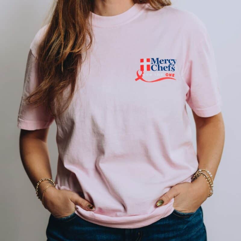 A front view of Mercy Chefs' "Love the One" t-shirt