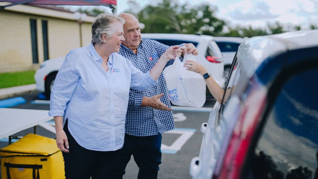 Chef Gary and Ann LeBlanc distributing hot meals to those affected by Hurricane Francine in Live Oak, FL.
