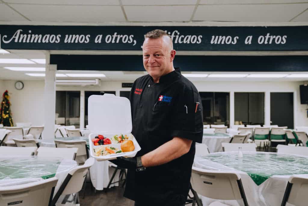 Chef Jon presenting Mercy Chefs' first meal prepared for those impacted by the Southern California wildfires.