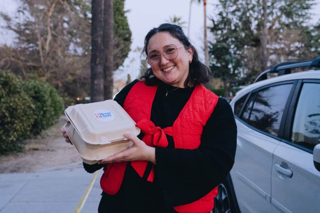 A California wildfire survivor receiving a Mercy Chefs meal.