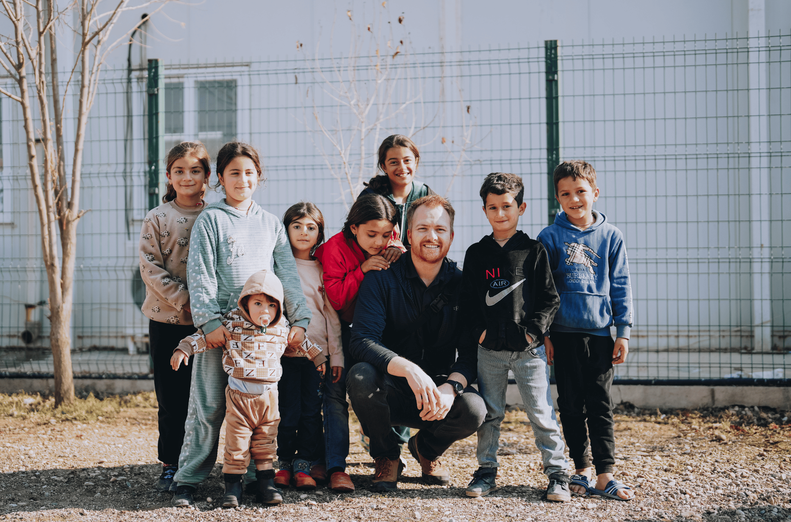 Mercy Chefs team member with Kids in a refugee camp in Northern Iraq