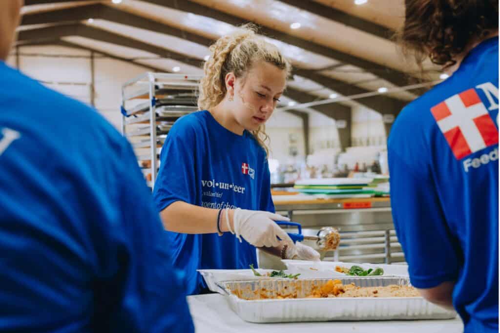 A Mercy Chefs volunteer preparing hot meals for tornado victims in Tennessee