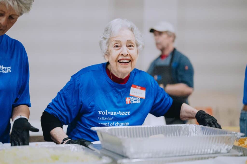 A Mercy Chefs volunteer preparing meals for tornado victims in Missouri