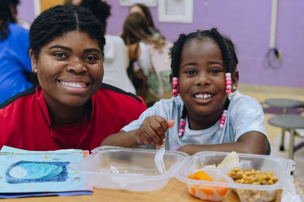 Chef Rachel providing a hot meal to a child in Nashville Public Schools