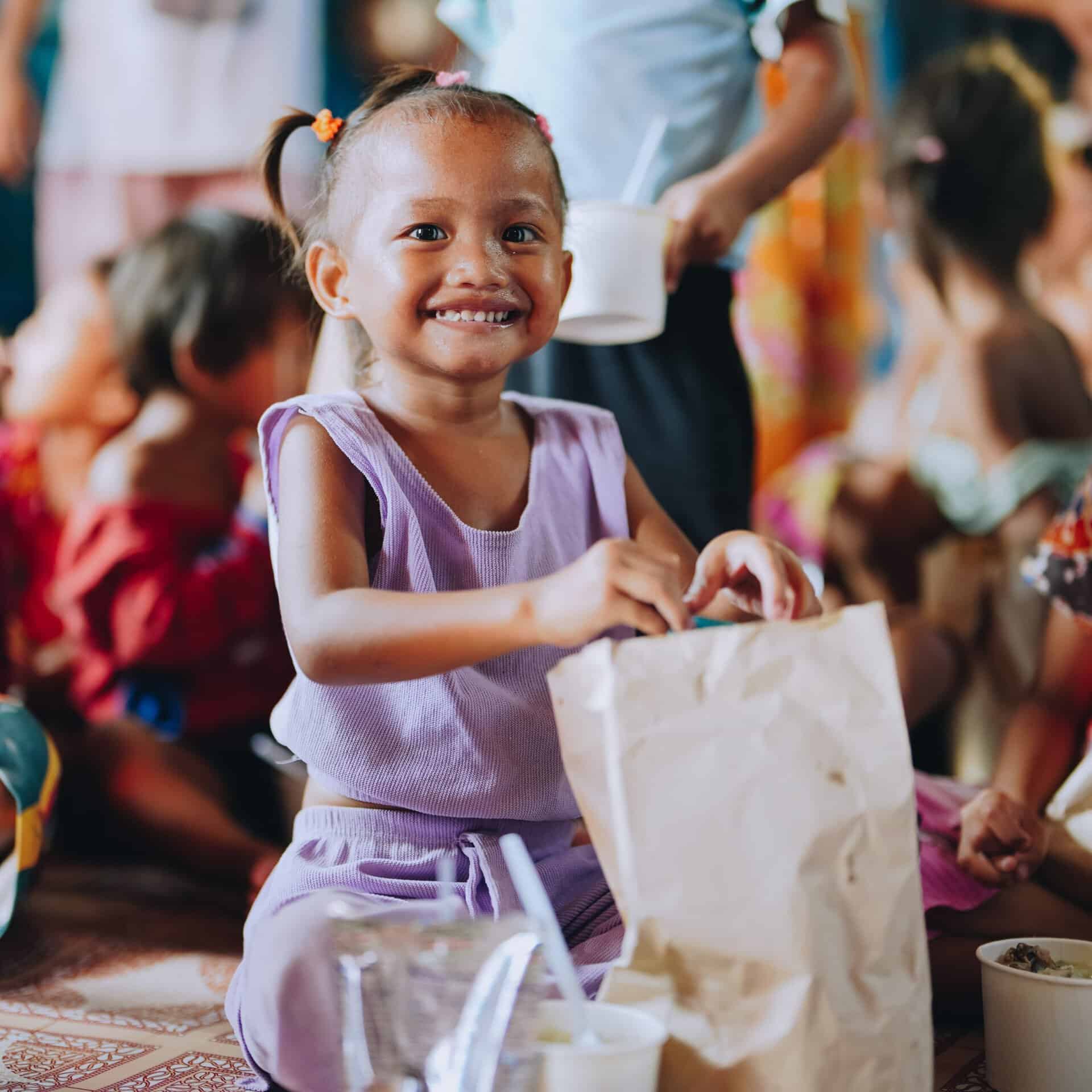 A child receives a hot meal in the Philippines