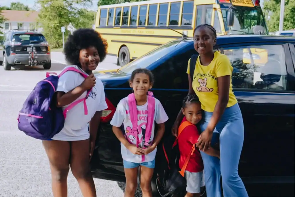 Four young girls receive backpacks in Chesapeake, Virginia