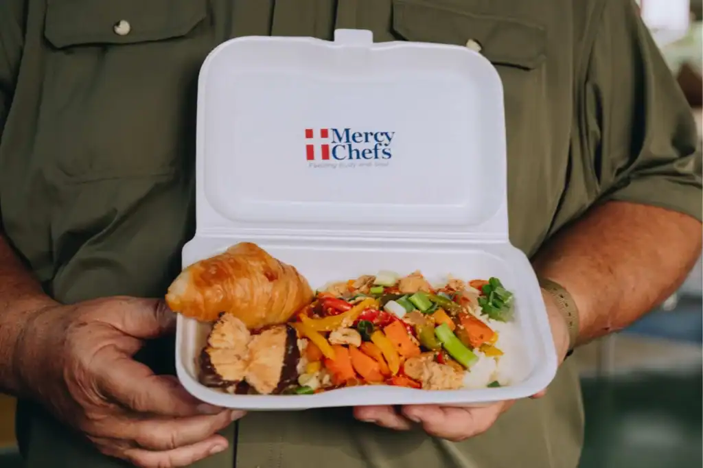 Mercy Chefs meal–chicken stir-fried with vegetables, rice, and croissant, Colombia