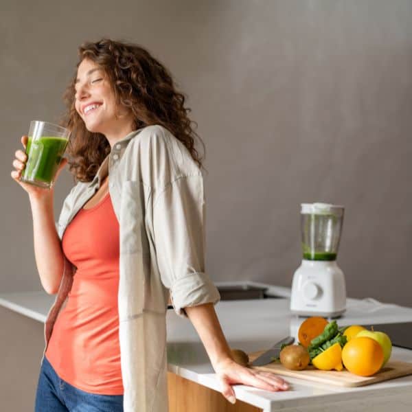 woman detoxing in her kitchen
