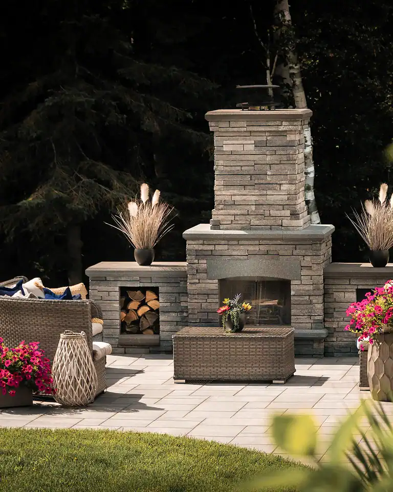Firepit outdoor fireplace with stone surround and seating area.
