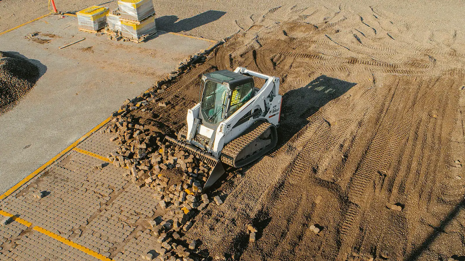 Construction equipment at work for landscape project, job opportunity.