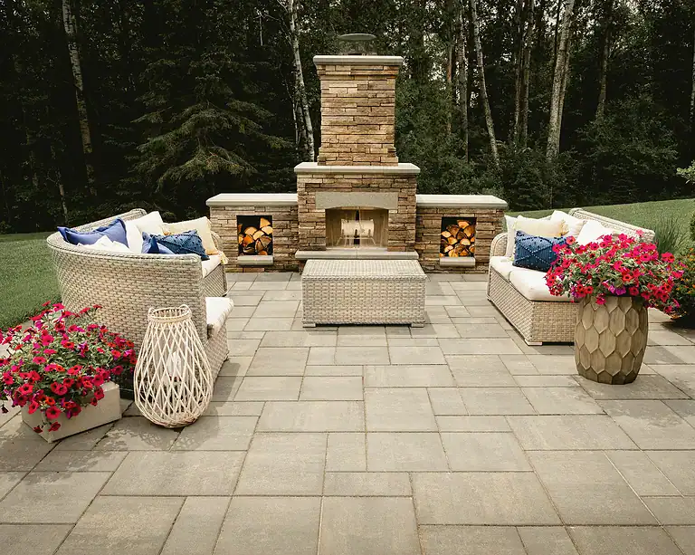 Outdoor fireplace with cozy seating for a relaxing backyard retreat.