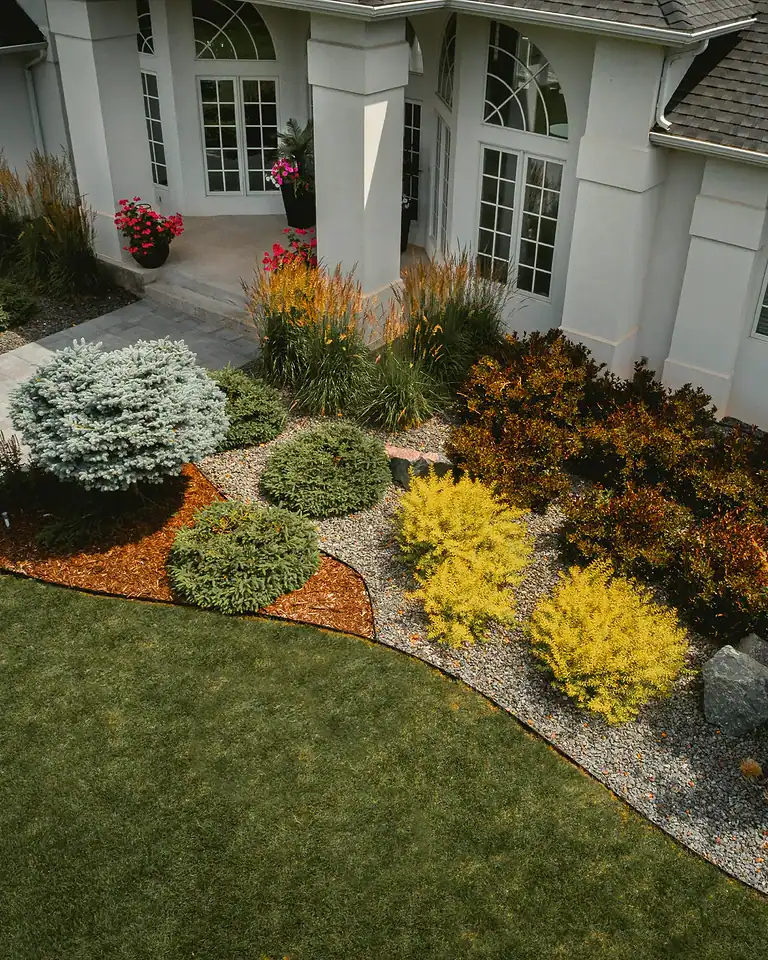 Beautiful backyard garden with vibrant plants and well-maintained lawn.