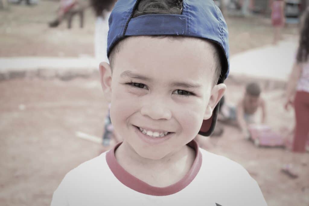 A young boy wearing a hat.