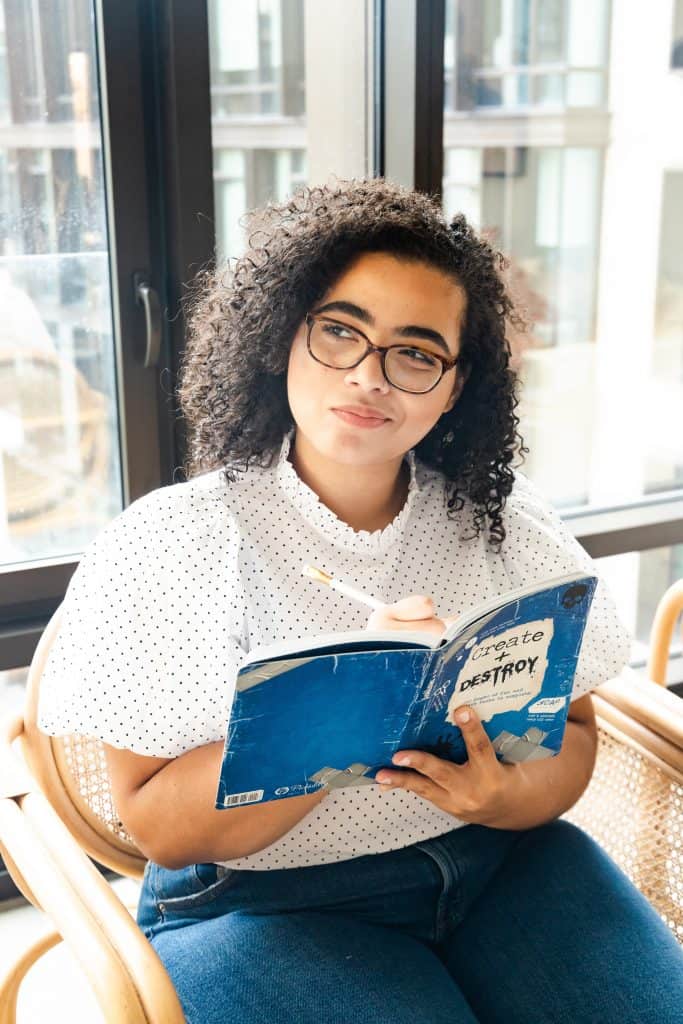 A woman writing down her thoughts