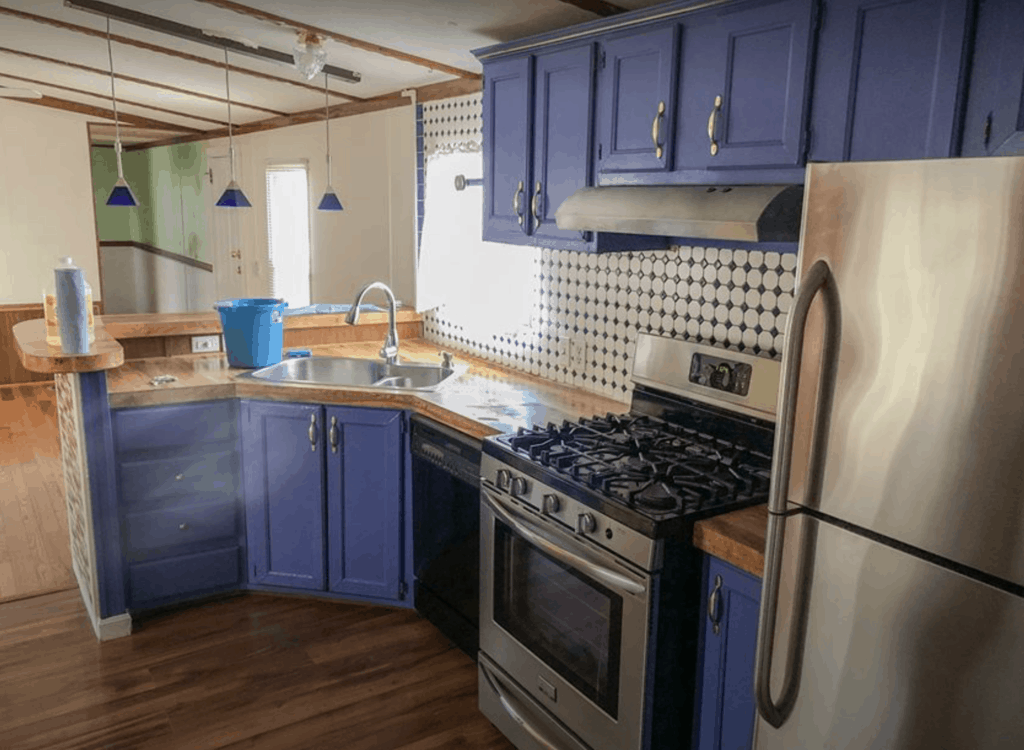 Single-wide-manufactured-home-with-blue-kitchen-cabinets Single Wide Manufactured Home With Blue Kitchen Cabinets