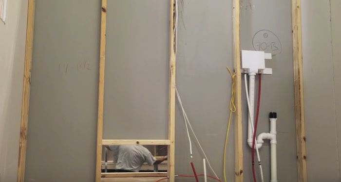 plumbing and electrical cables in manufactured home wall
