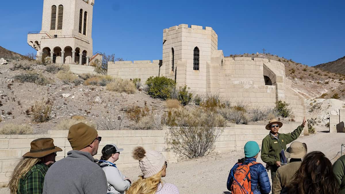 A ranger leads visitors on a tour of Scotty's Castle in Death Valley National Park.