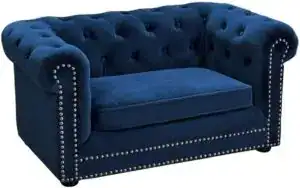 “Elegant navy blue designer dog bed for small dogs with tufted velvet fabric and silver stud accents — luxury pet furniture for modern homes.”