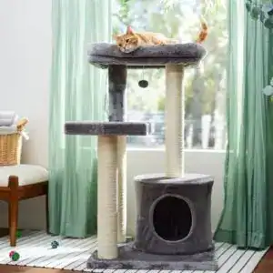 Tall grey cat tree with a lounging orange cat — featured in the best cat supplies guide and listed among must-have cat products for indoor cats